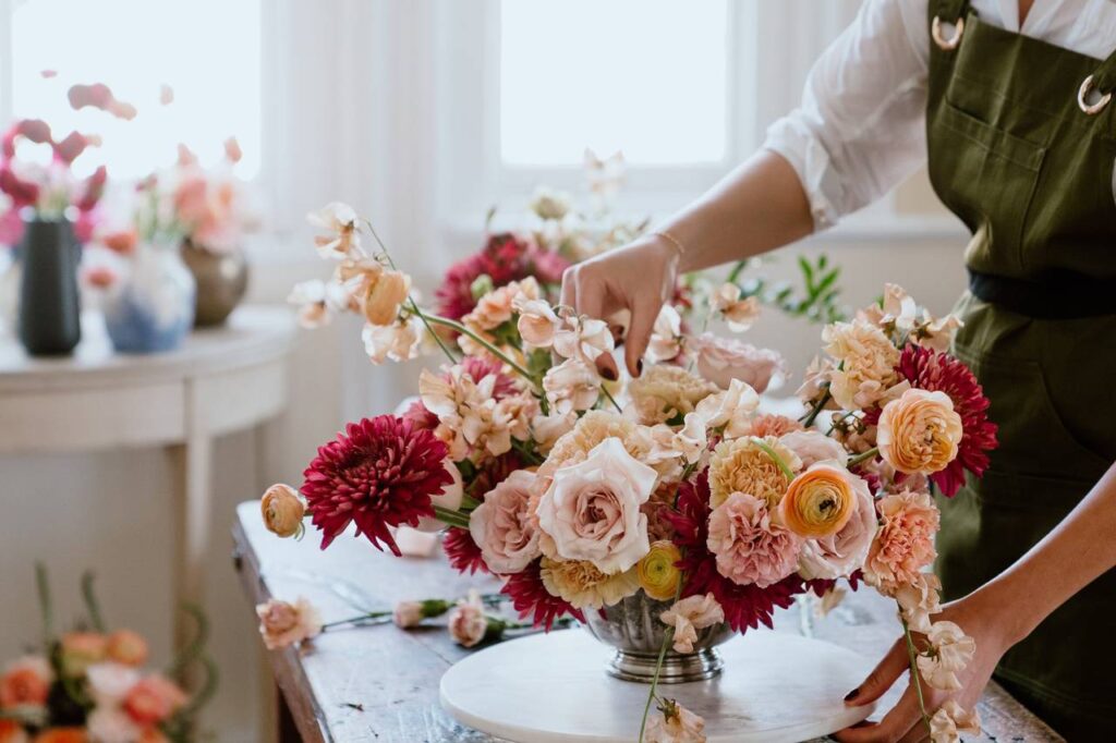 Arranging Wedding Rustic Flowers (Credit: Wedding Wire)