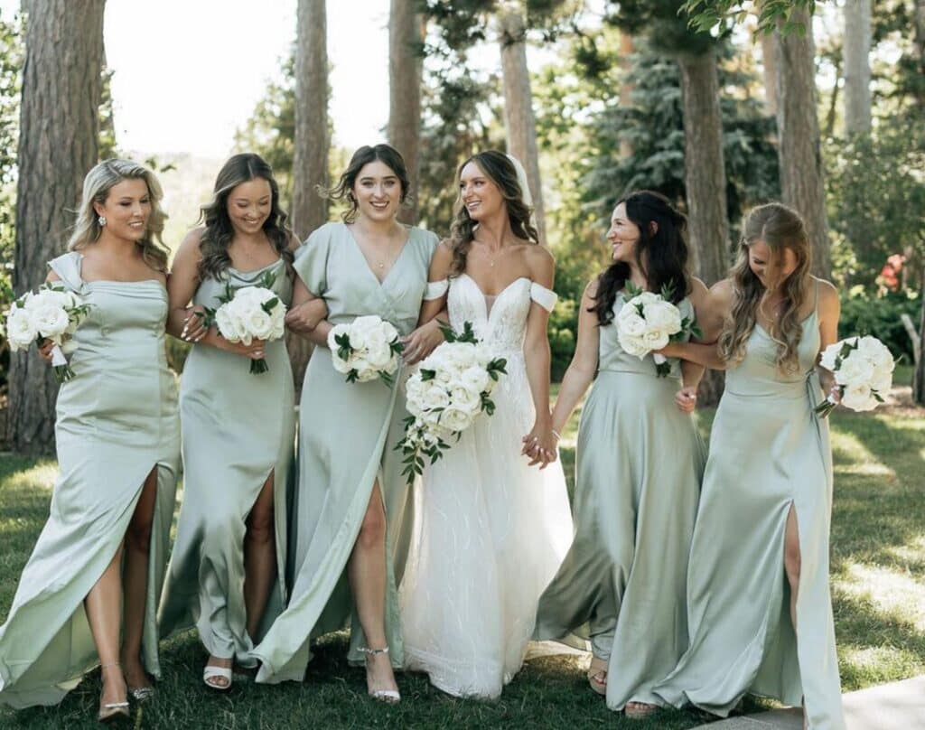 Bridesmaids in gorgeous satin sage dresses