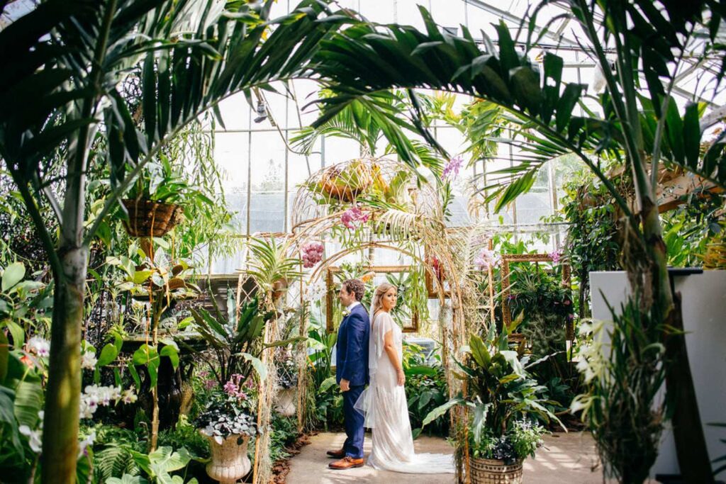 Beautiful Couple at their dream garden greenhouse wedding