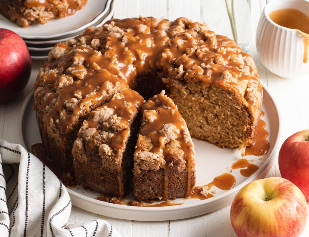 Cinnamon Cake drizzled with caramel sugar, sliced apples, and sour cream.