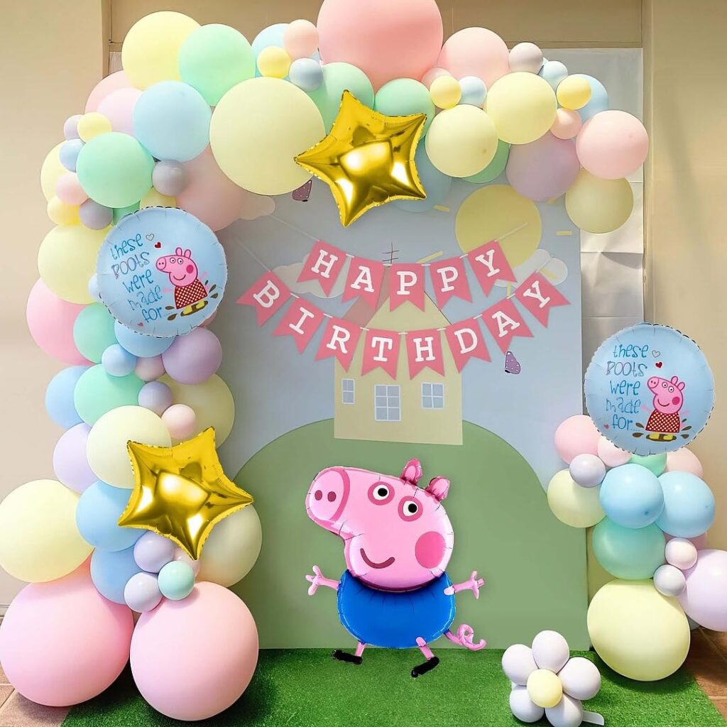 Peppa Pig Banner and pastel pink and yellow balloon arch