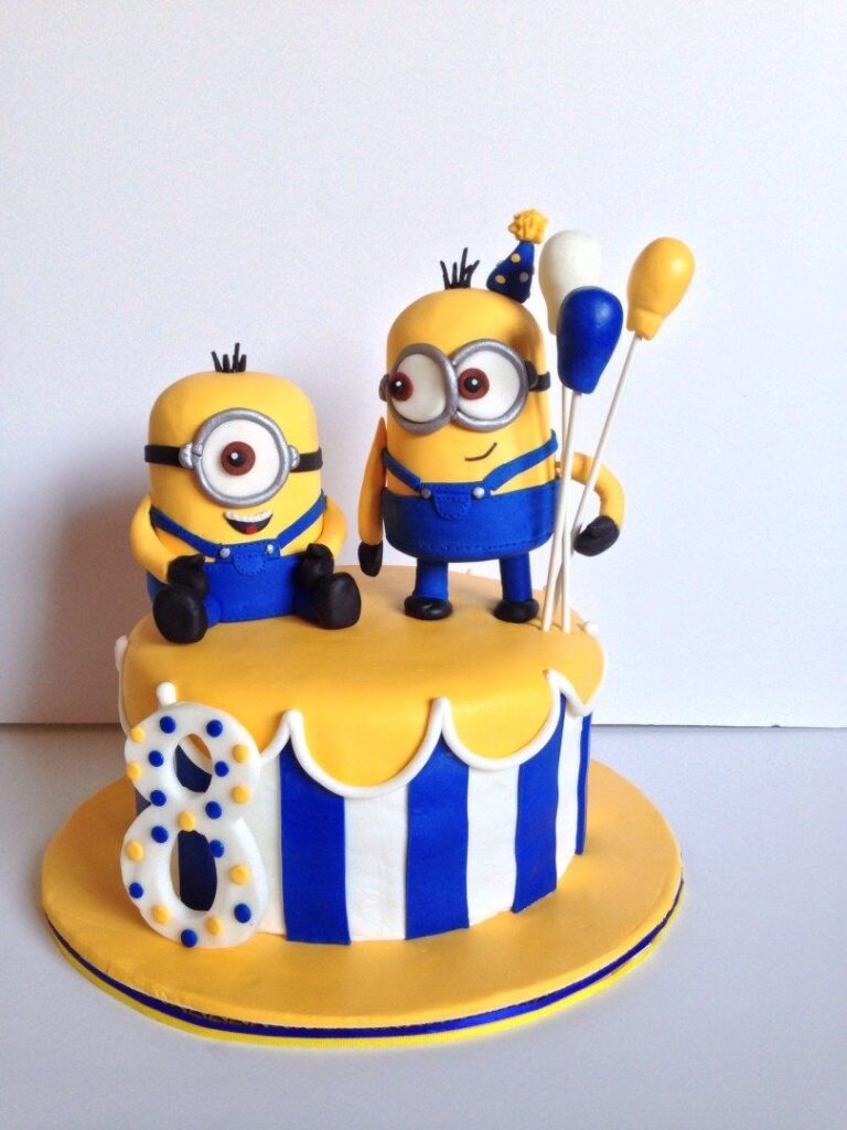 minions birthday cake with blue, yellow and white buttercream frosting