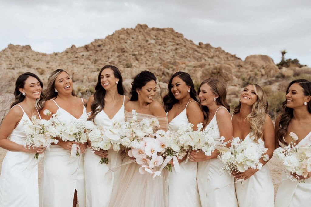 Line of Bridesmaids Holding Simple Floral Rose and peony Bouquets