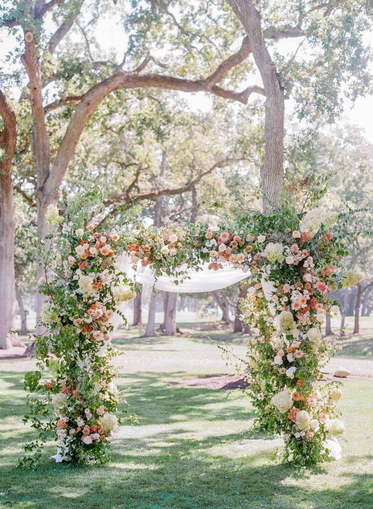 Beautiful Floral Arch with greenery and floral arrangements