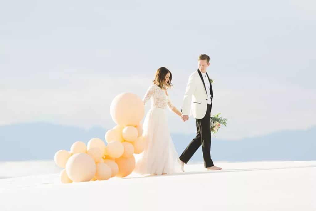 Happy Couples Walking and holding balloon and bouquet