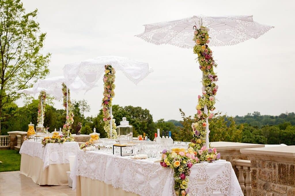 Wedding Decor With Winding, white table cloth and floral centerpiece