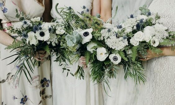 Bridesmaids holding flower bouquets