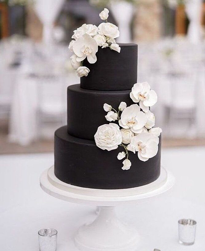 Gorgeous Wedding Cake with Black coated icing, 3-tier and white floral topper