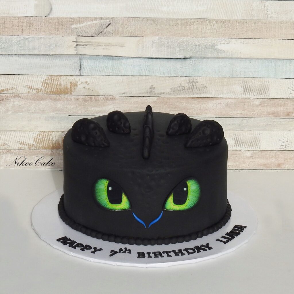 Toothless Birthday Cake With Black icing and Toothless eyes