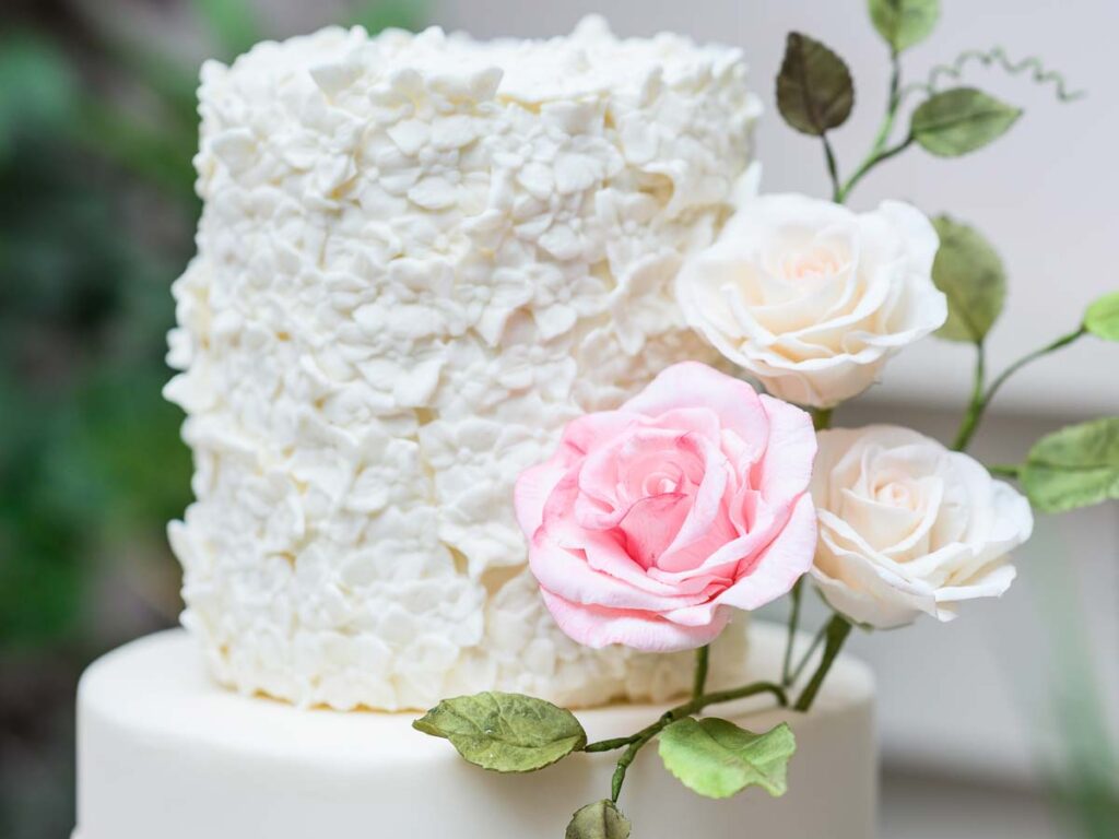 Modern Fondant Floral Wedding Cake with gravy texture and white rose topper