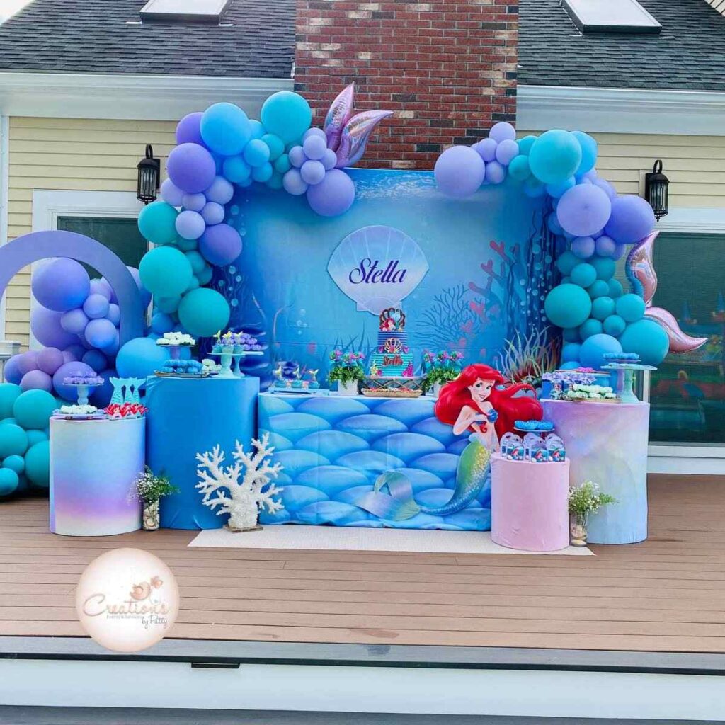 Beautiful yet cut blue balloon arch and under the sea banner