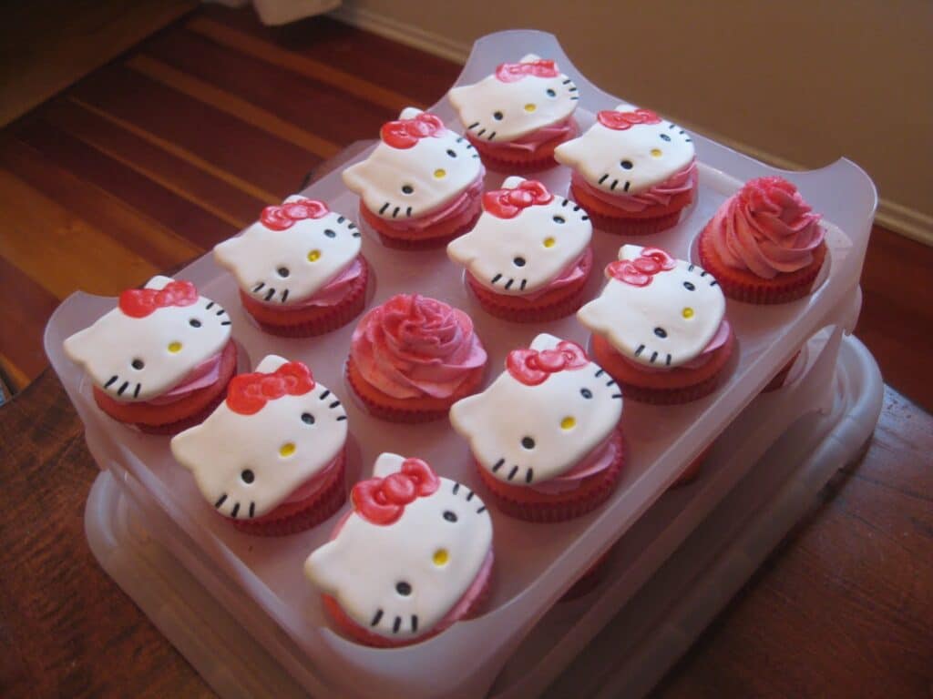 Adorable DIY Pink Hello Kitty Cupcakes with cute Edible Hello Kitty and Pink Ribbon