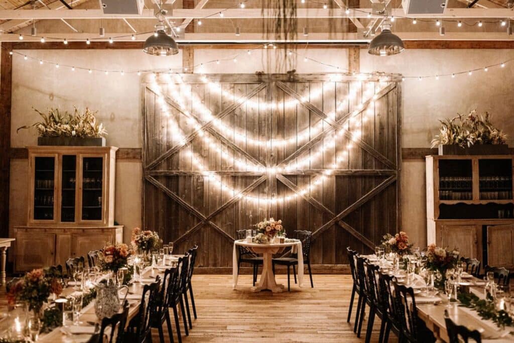 Rustic Barn Wedding Venue with twinkling light setup