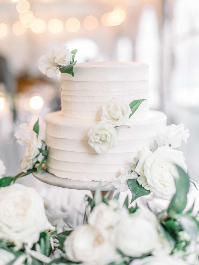 Beautiful White Buttercream Wedding Cake with fresh flower decoration