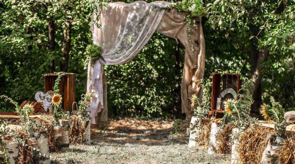 Backyard Boho Wedding with Boho Floral and Greenery Arch