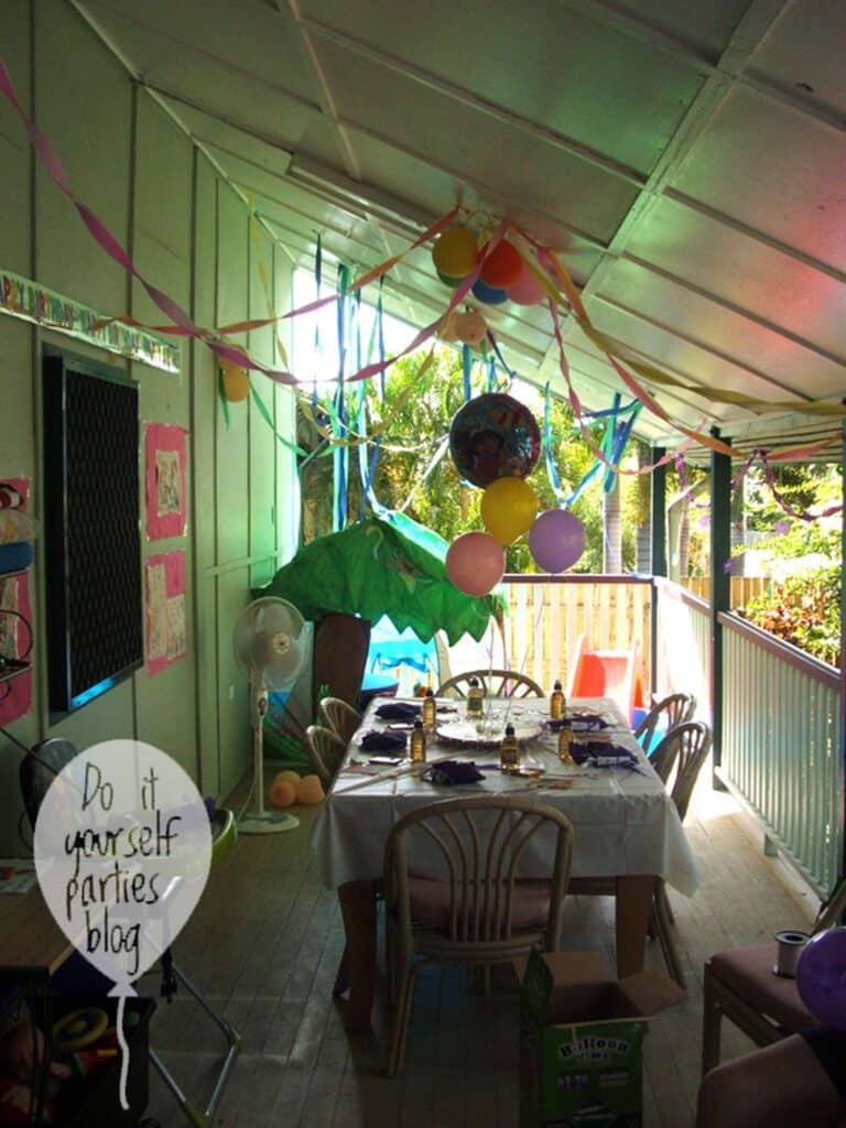 Dora birthday party decor with colorful streamers and balloons