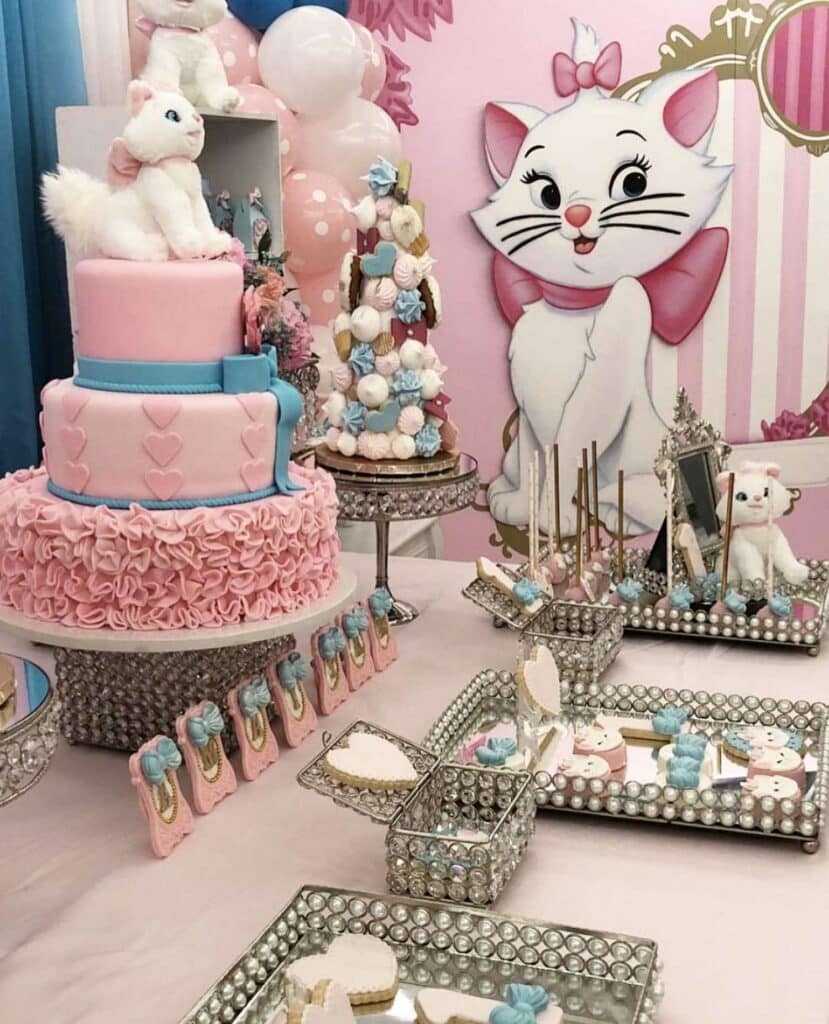 Marie the Aristocats birthday party decor with custom Cutout, pink birthday cake and pastel balloons