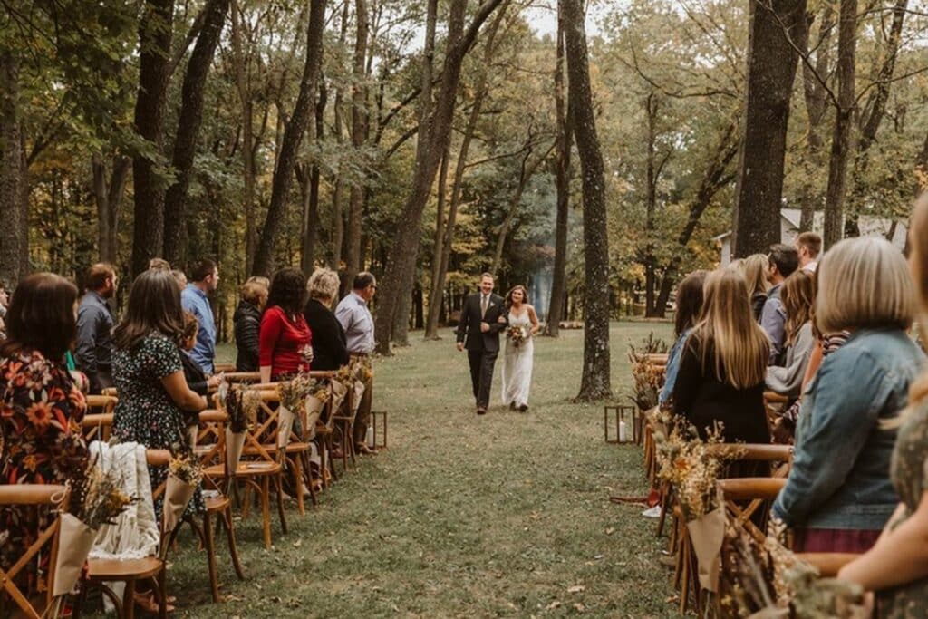 Beautiful Wedding Couple exchange vows in gorgeous forest style wedding