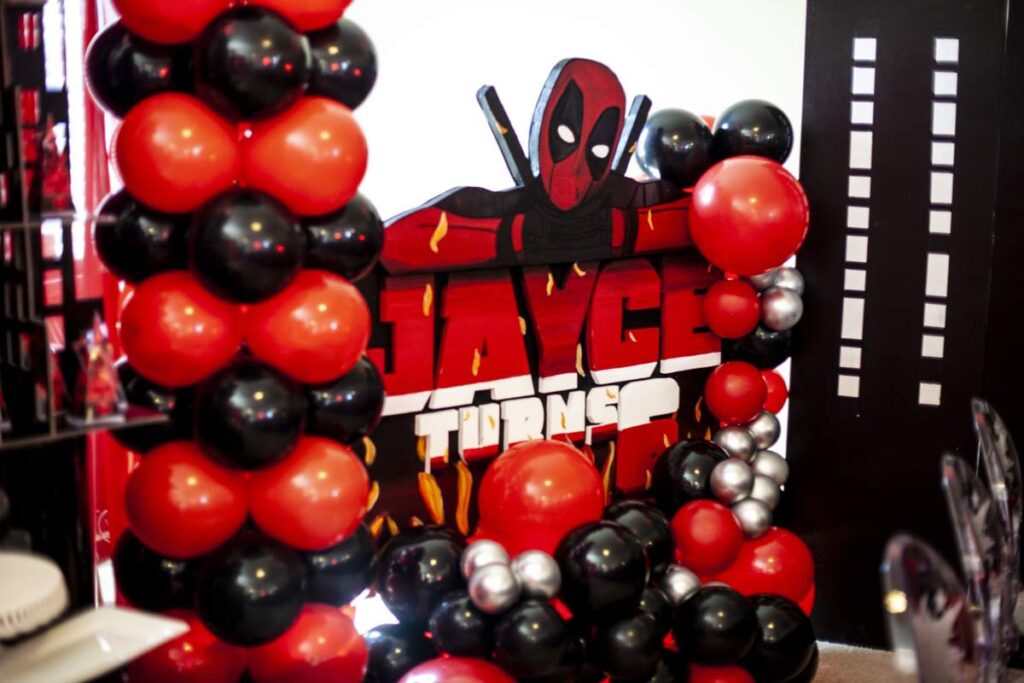 red and black balloons and tablecloth