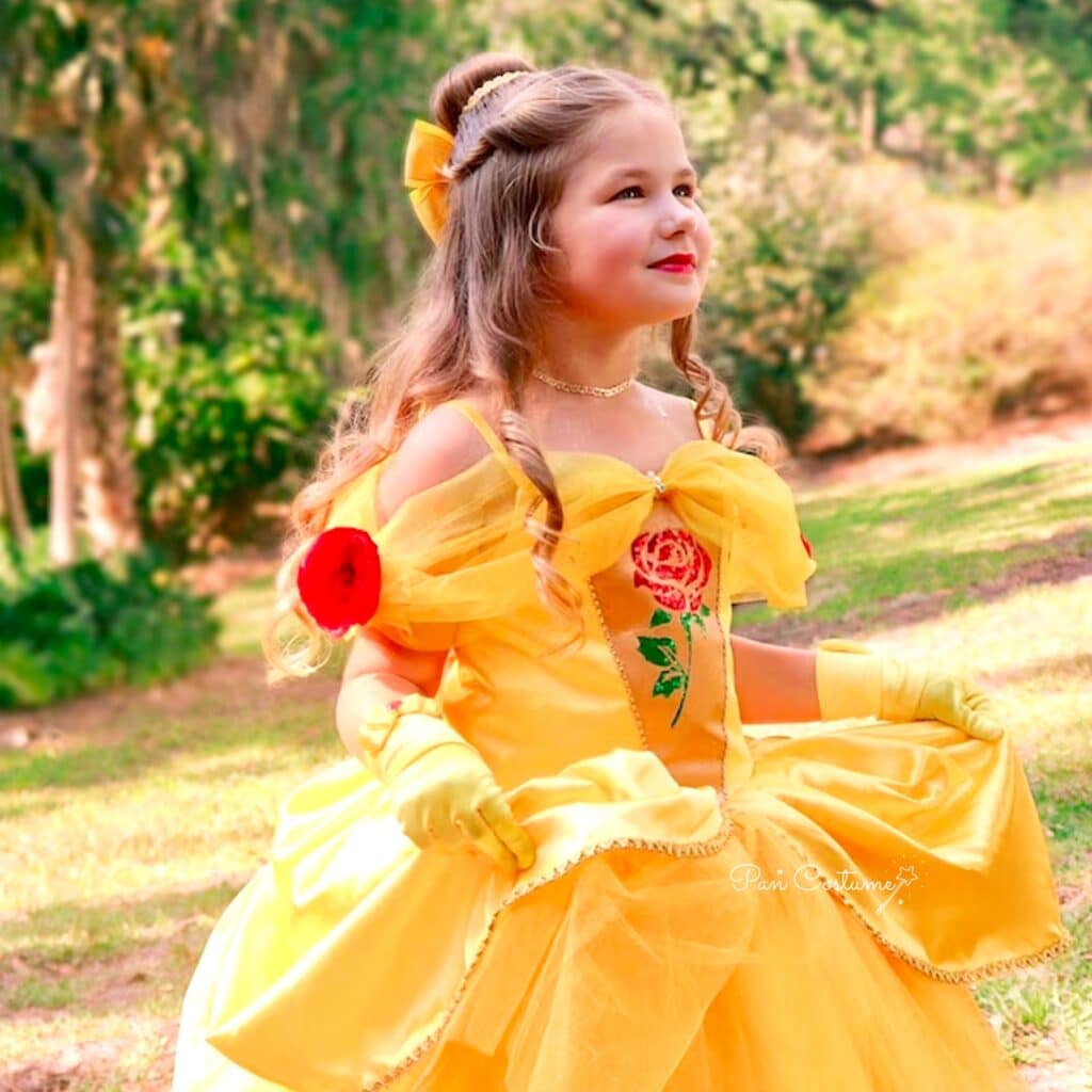 Beautiful little girl dressed in gorgeous yellow princess belle