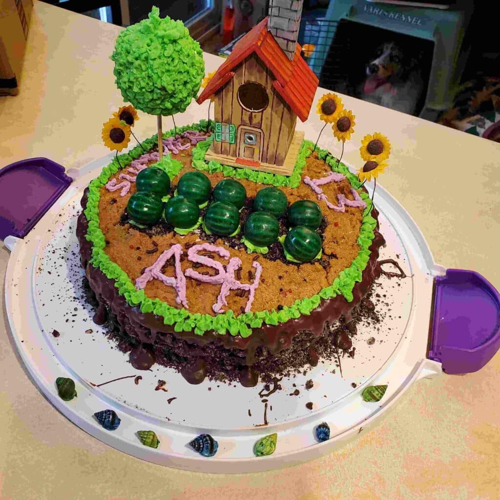 Stardew Valley Birthday Cake with edible fondant barn farmhouse and sunflower crops